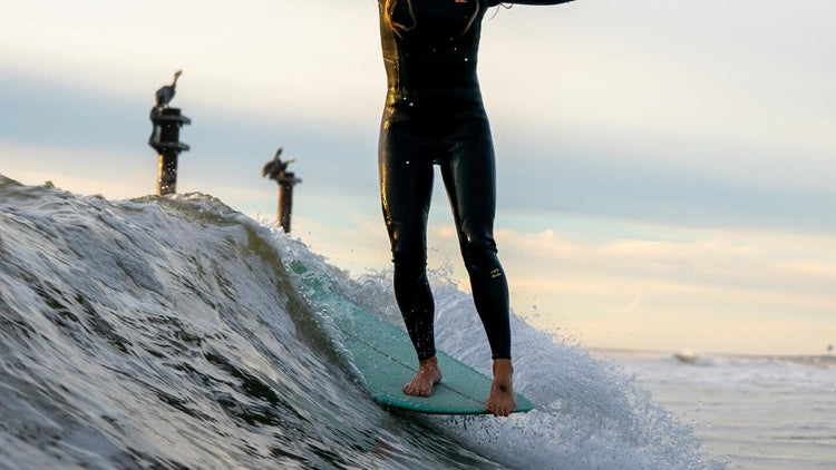 Surfer hanging ten while surfing along the Mid-Atlantic of the East Coast.