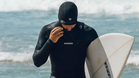 Surfer wearing the Manera X10D Wetsuit