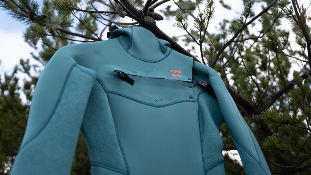 Detailed close up of the chest zip entry on the Billabong Women's Synergy Wetsuit.